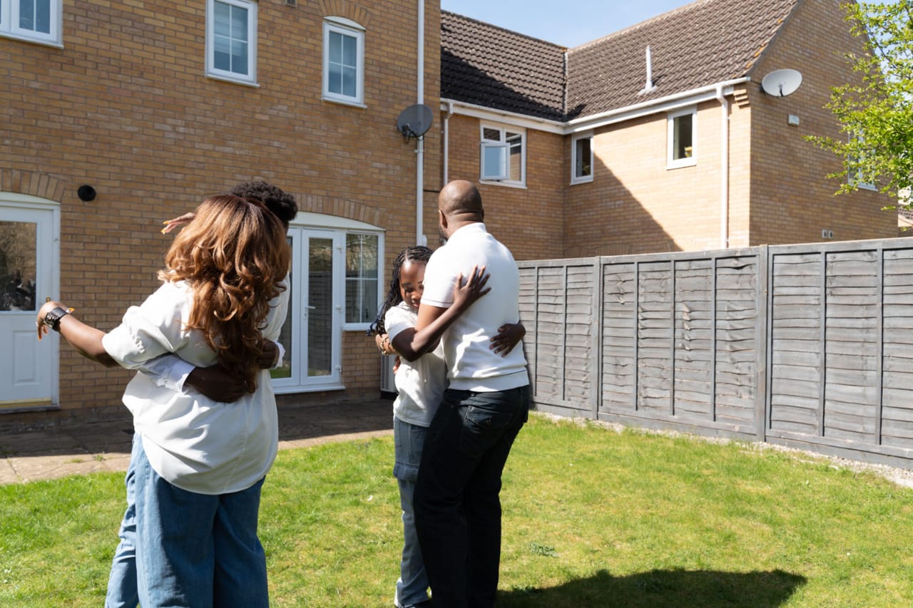 African parents and children in a community setting